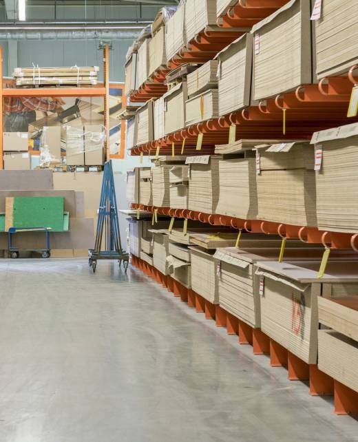 fiberboard and chipboard sheets on shelves in the building materials store